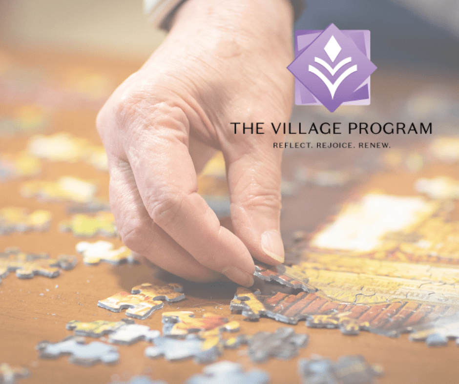 A hand carefully places a piece in a colorful jigsaw puzzle, showcasing a moment of engagement and joy.