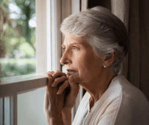 1-31-24 - Grace Management Elderly woman looking out of the window