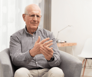 5-22-24 - Grace Management Senior man with Arthritis holding hand in pain