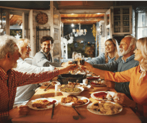 11-6-24 - Grace Management Family cheering over a meal