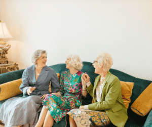Senior women laughing together on cough