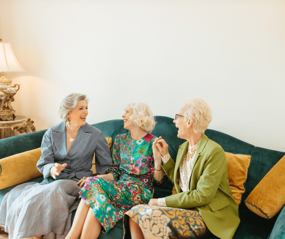 Senior women laughing together on cough