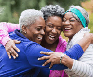 1-29-25 - Grace Management Group of three women hugging and smiling