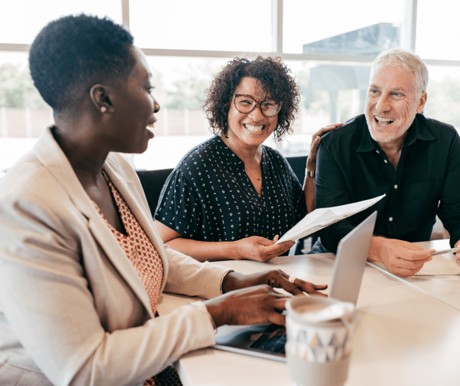 Group of three people having a meeting.