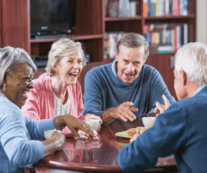 2-26-25 - Grace Management Group of men and women gathered and laughing