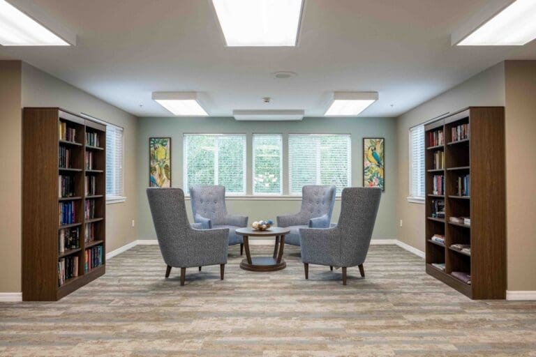 A comfortable, well-lit bedroom in a private apartment at Augustine Landing, a community offering senior living near Orange Park.