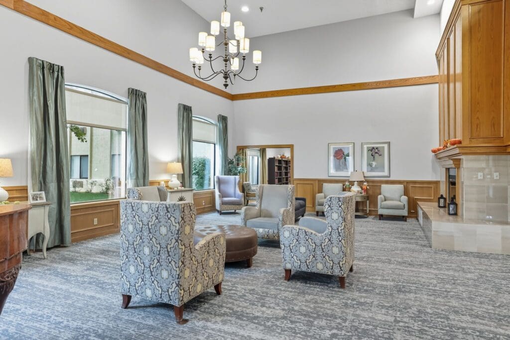 Spacious living area featuring elegant seating, warm lighting, and vibrant decor, creating a welcoming atmosphere.
