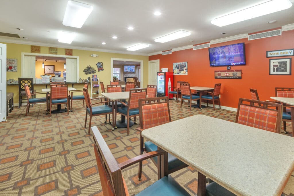 2022-05-26-HomeJab-046 - Grace Management Bright dining area featuring comfortable seating, vibrant decor, and a welcoming atmosphere for social engagement.