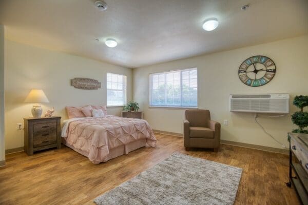Interior image of a resident's studio with full size bathroom, mini kitchenette, and spacious living area.