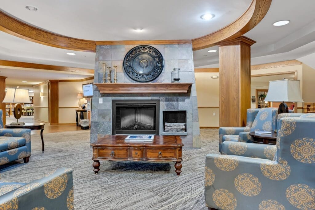 Welcoming lounge with stylish seating, a cozy fireplace, and elegant decor, promoting comfort and community engagement.