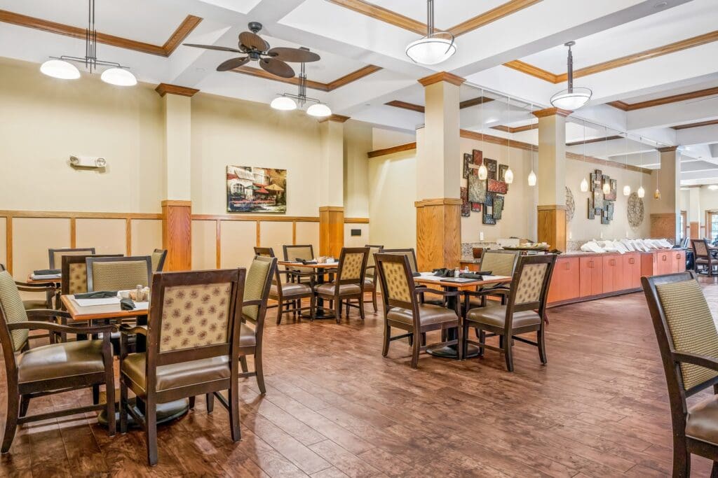 Elegant dining area with stylish furniture, warm lighting, and tasteful decor, inviting a vibrant dining experience.