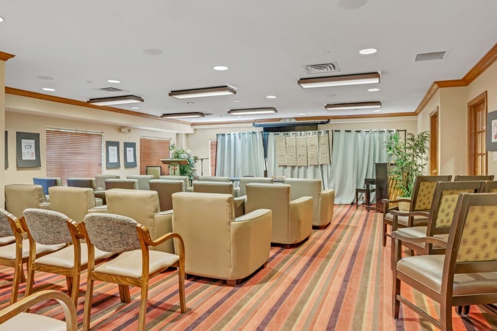 Elegant community room featuring comfortable seating, stylish decor, and a welcoming atmosphere for social events.