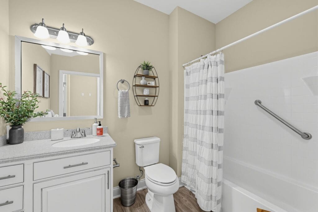 Spacious bathroom featuring modern fixtures, elegant decor, and accessible elements for a comfortable living experience.