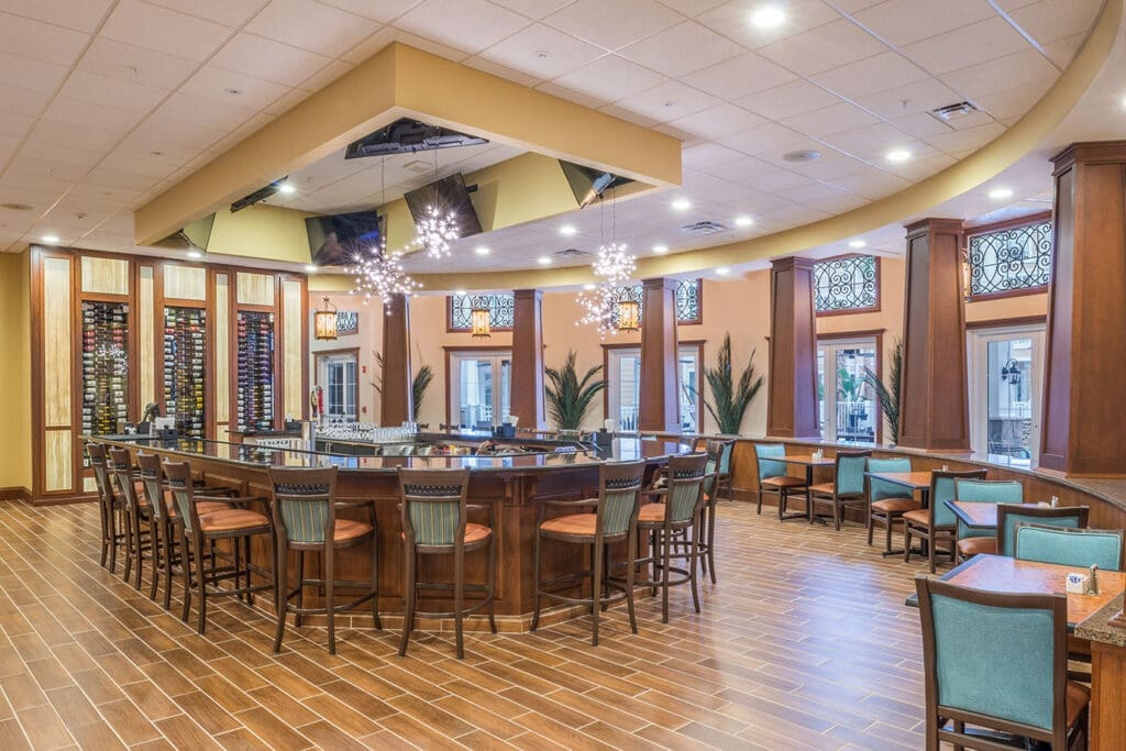 Elegant bar area with stylish seating, showcasing upscale amenities and a vibrant atmosphere for socializing.