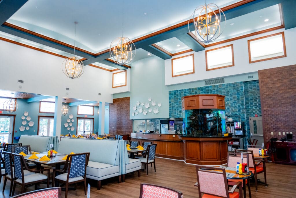 Bright, inviting dining area featuring upscale decor, cozy seating, and a vibrant atmosphere, perfect for community gatherings.