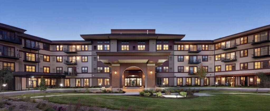 Exterior-1-copy-2-scaled - Grace Management Elegant senior living community featuring a welcoming entrance, beautifully landscaped grounds, and upscale residential amenities.