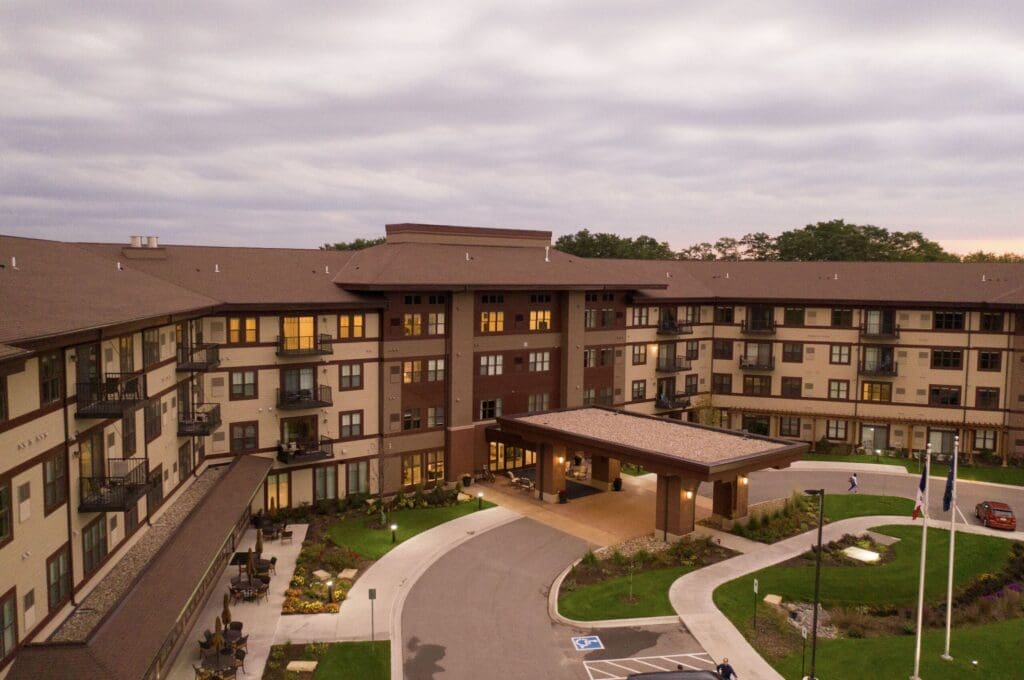 Exterior-4-scaled - Grace Management Upscale senior living community with elegant architecture, beautifully landscaped grounds, and welcoming entrance.