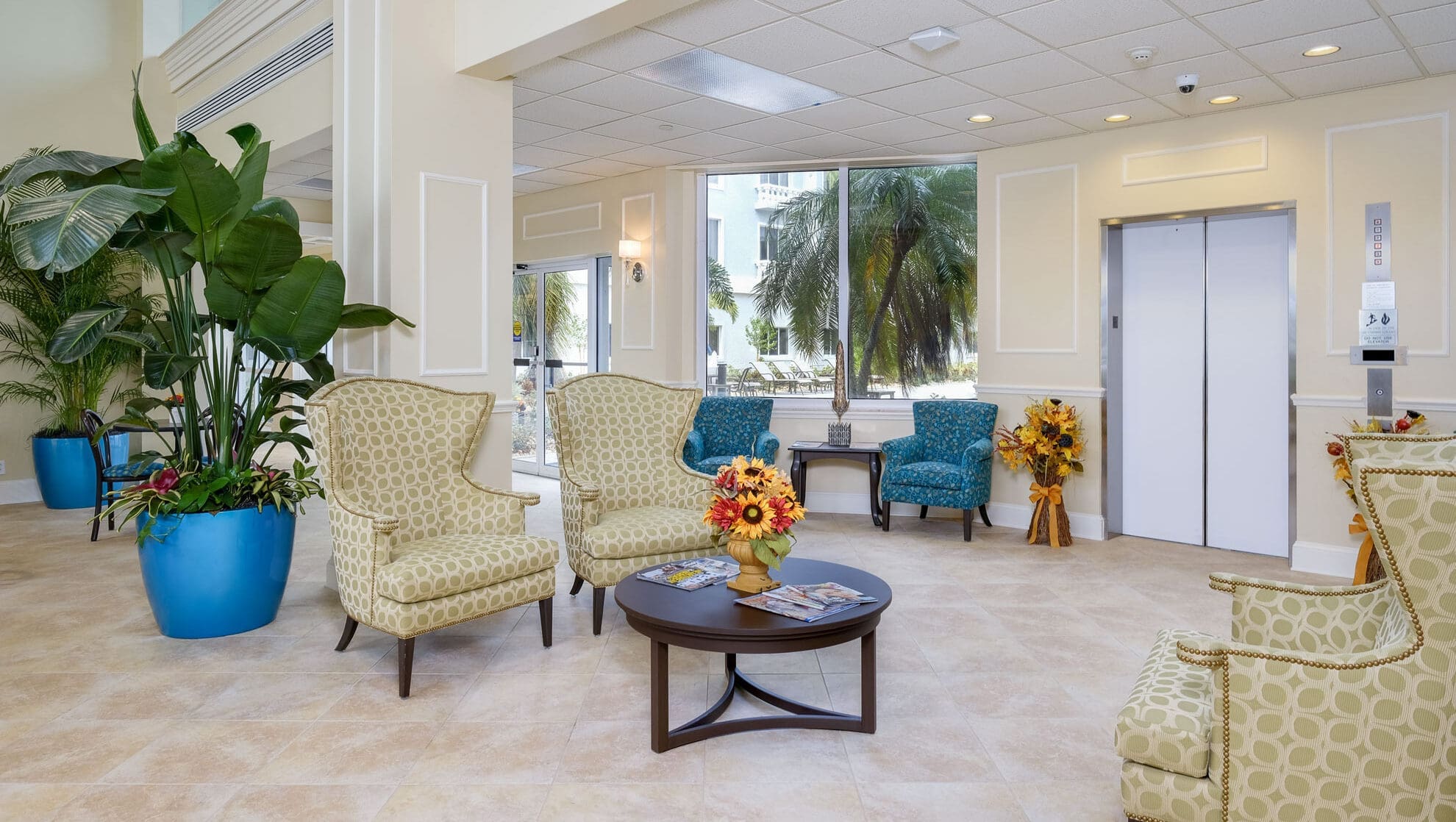 A resident bedroom featuring a bed and nightstands at The Summit of Fort Myers, an excellent option for independent living.