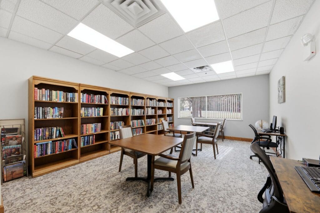 Library_NorthgatePark - Grace Management Inviting library with wooden shelves filled with books, comfortable seating, and natural light enhancing a vibrant learning space.