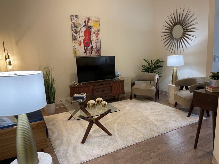 A furnished bedroom at The Magnolia at Oxford Commons, a senior living community in Tupelo, offering assisted living, and memory care.