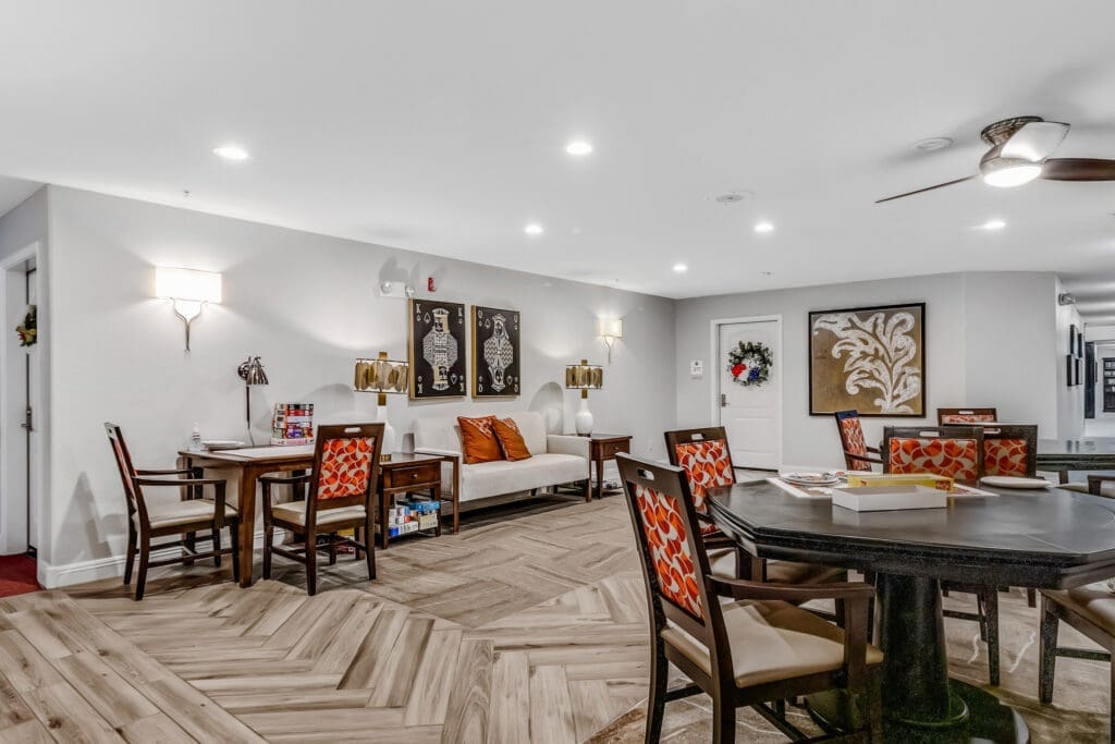 MG_4467 - Grace Management Welcoming common area featuring stylish furniture, vibrant decor, and warm lighting, encouraging social interaction and comfort.