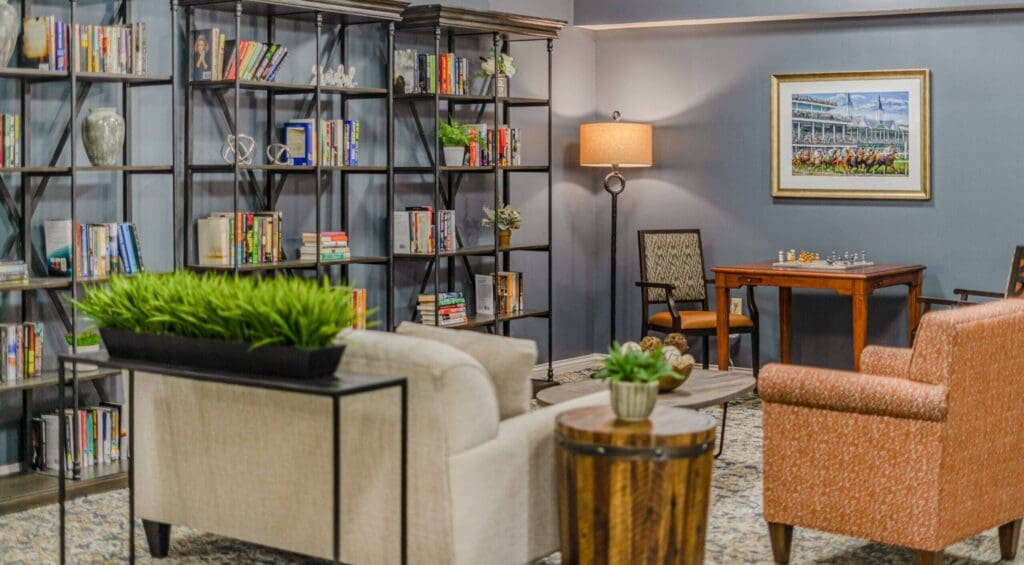 Welcoming lounge featuring cozy seating, vibrant bookshelves, and a chess table, promoting a vibrant social atmosphere.