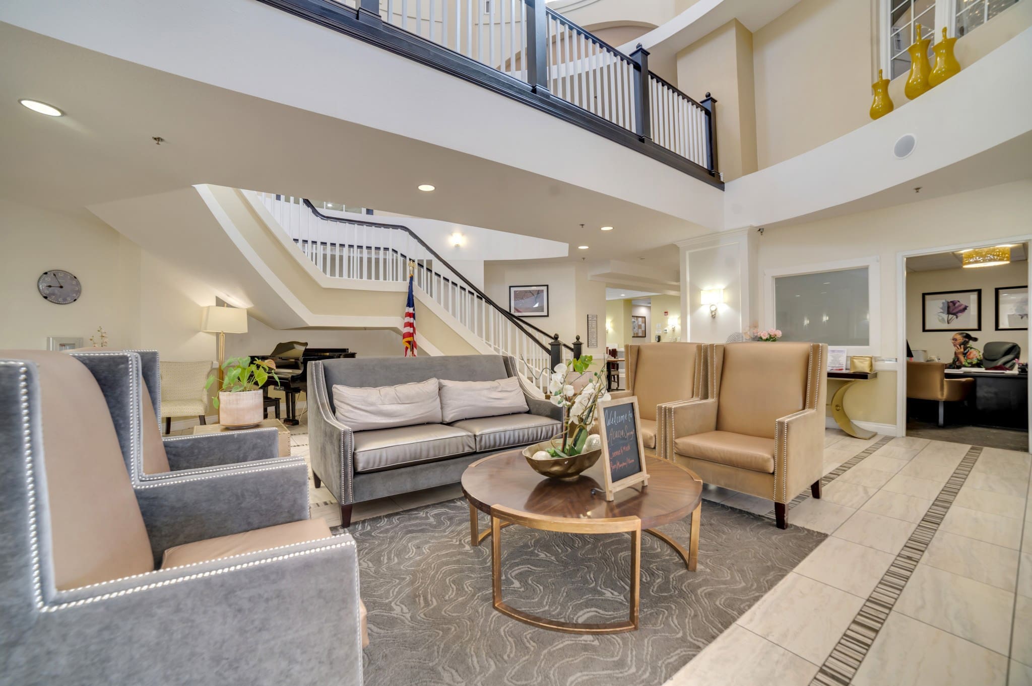 Resident bedroom with navy bedding and white furniture at Acacia Springs, a senior living community.
