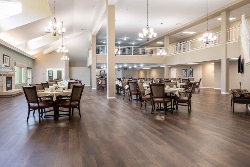 View of the grand dining hall from the second floor at Augustine Landing, a senior independent living community near Orange Park, FL.