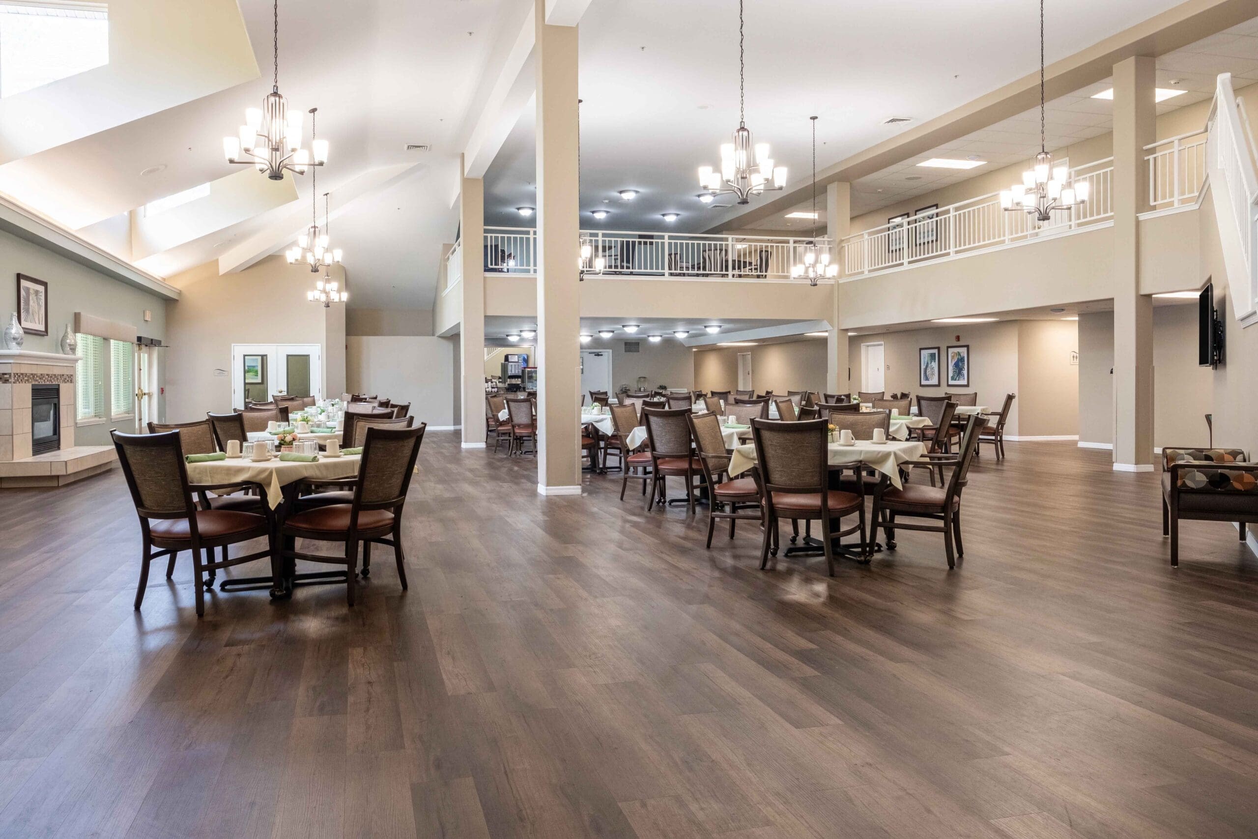 View of the grand dining hall from the second floor at Augustine Landing, a senior independent living community in Florida.