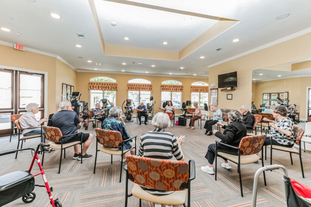 - Grace Management A group of residents participate in a seated exercise class in the fitness room at Woodhaven Village, a senior living community near Spring, TX.