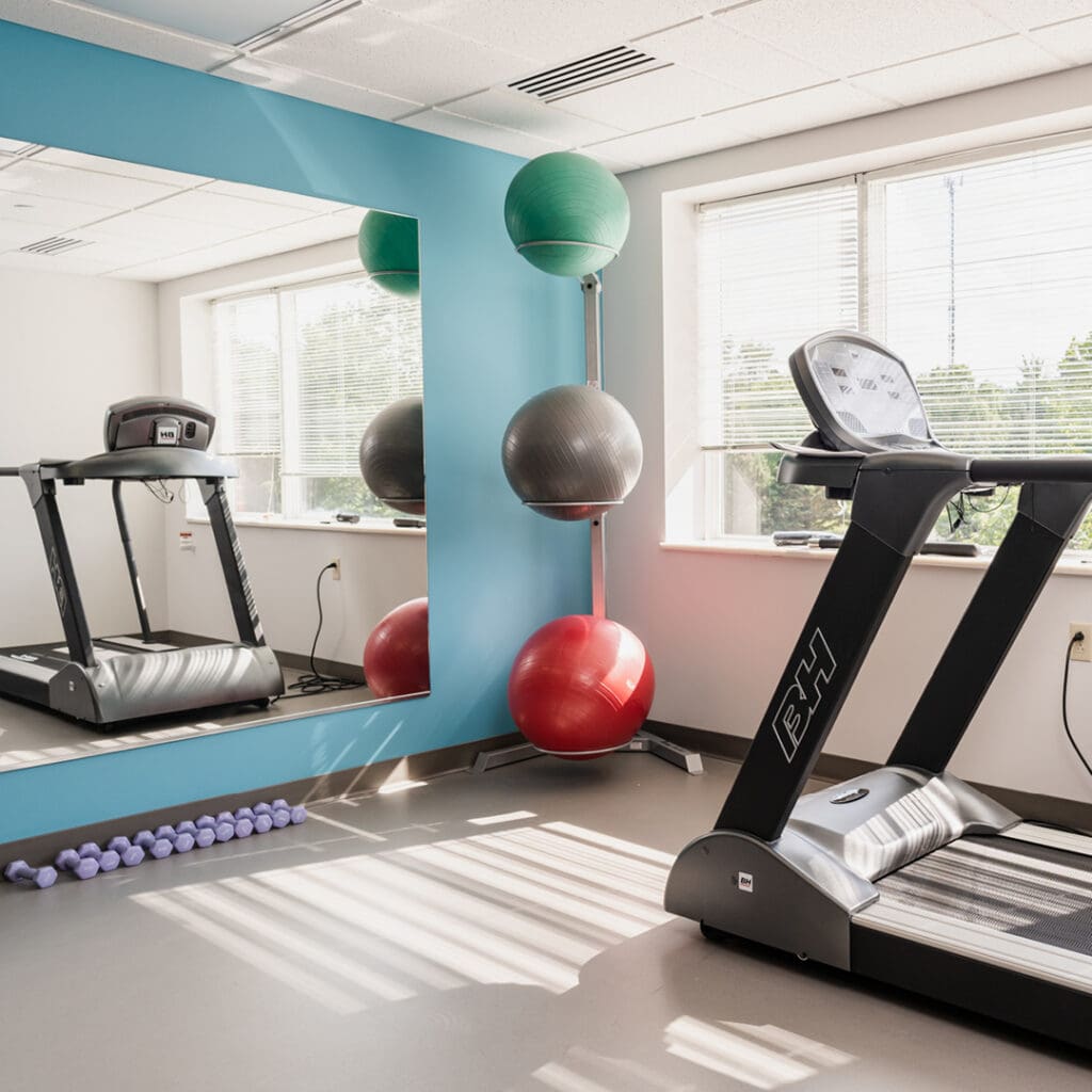 - Grace Management A gym with a treadmill, exercise balls, and weights at The Residence at Whitehall, a great option for senior living in Allegheny County.