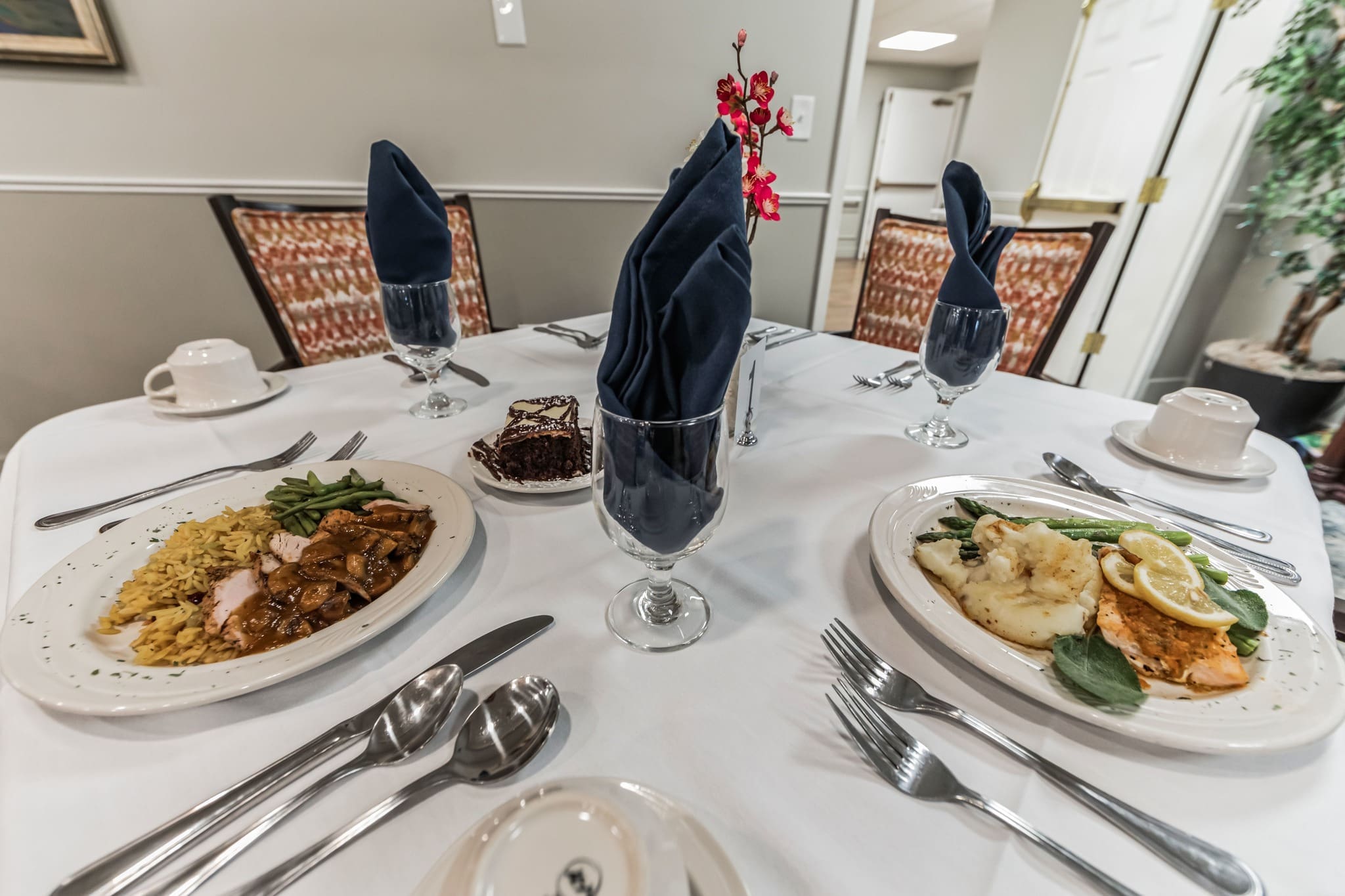 - Grace Management Food plated on table at Parkrose Estates, a provider of luxury independent senior living near Syracuse, NY.