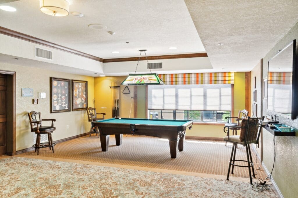 Interior image of the resident billiards room at The Country Club of La Cholla.