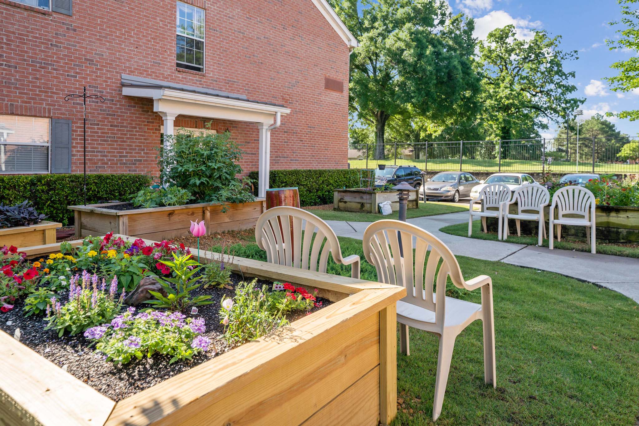 - Grace Management Exterior image of the Town Village Audubon Park's community garden boxes.