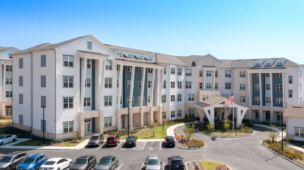- Grace Management Grand front entrance of The Summit of Germantown, providing senior living in Cordova with modern amenities and a welcoming environment.