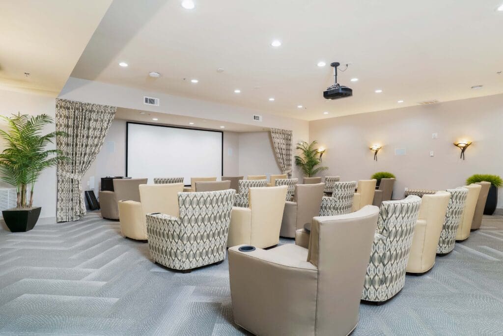 - Grace Management Rows of plush armchairs are arranged for movie screenings in the theater at Celebration Village Forsyth, a senior living community near Cumming, GA.