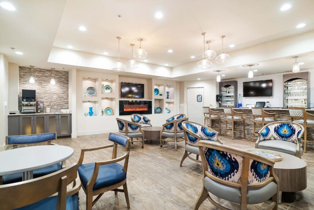 - Grace Management A beverage station, bar area, and intimate seating furnish the lounge at Celebration Village Forsyth, a senior living community near Alpharetta, GA.