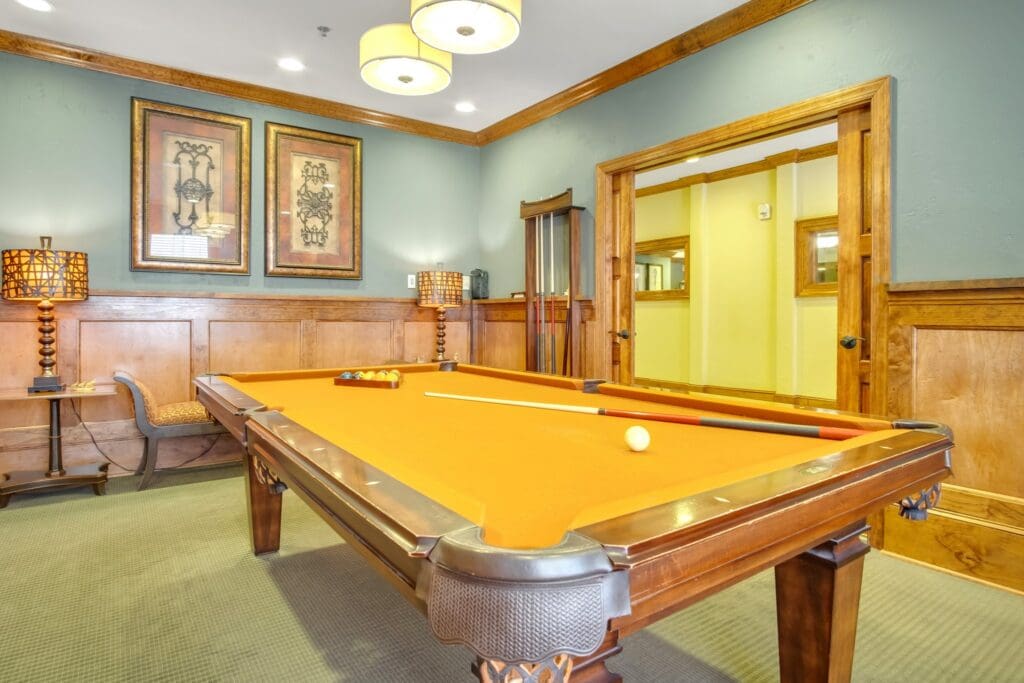 A pool table is racked and ready for a game in the billiards room at The Landon at Lake Highlands, an independent living community near Rockwall, TX.