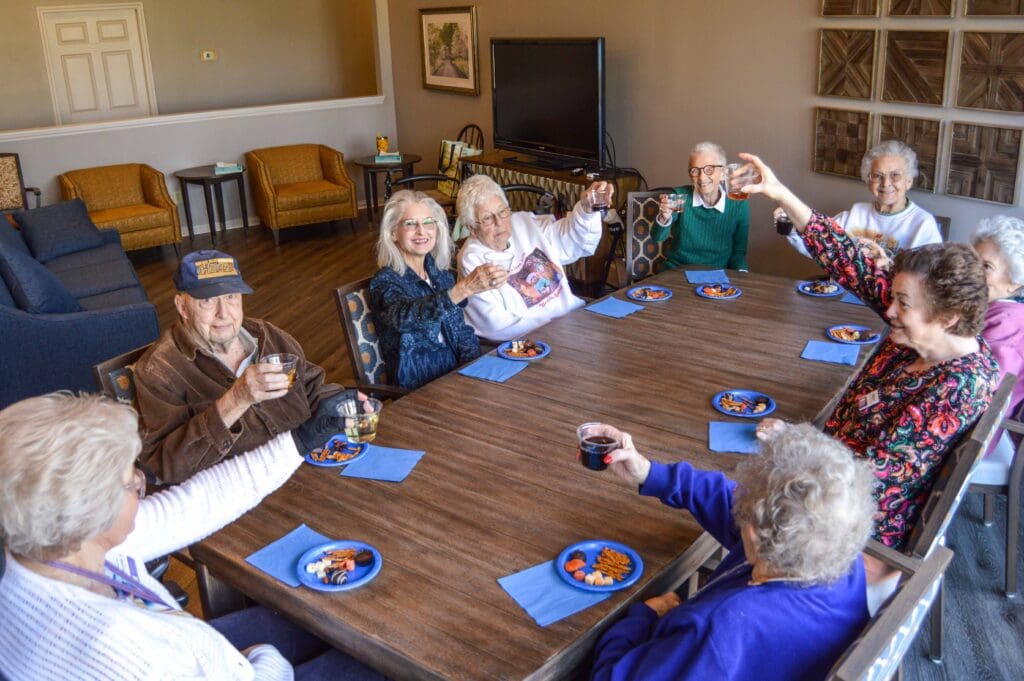 - Grace Management Residents sit around a table with refreshments during a social gathering at Inspirations of Mount Washington, a senior living community in Louisville, KY.