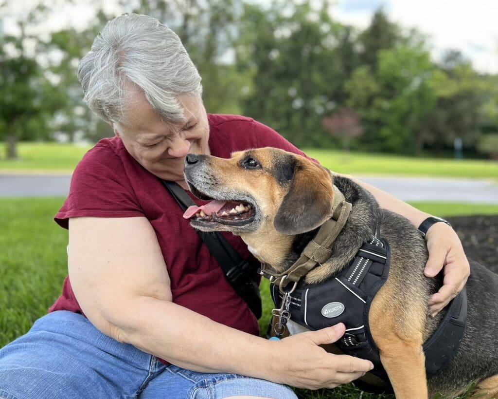 Senior woman and her dog smiling