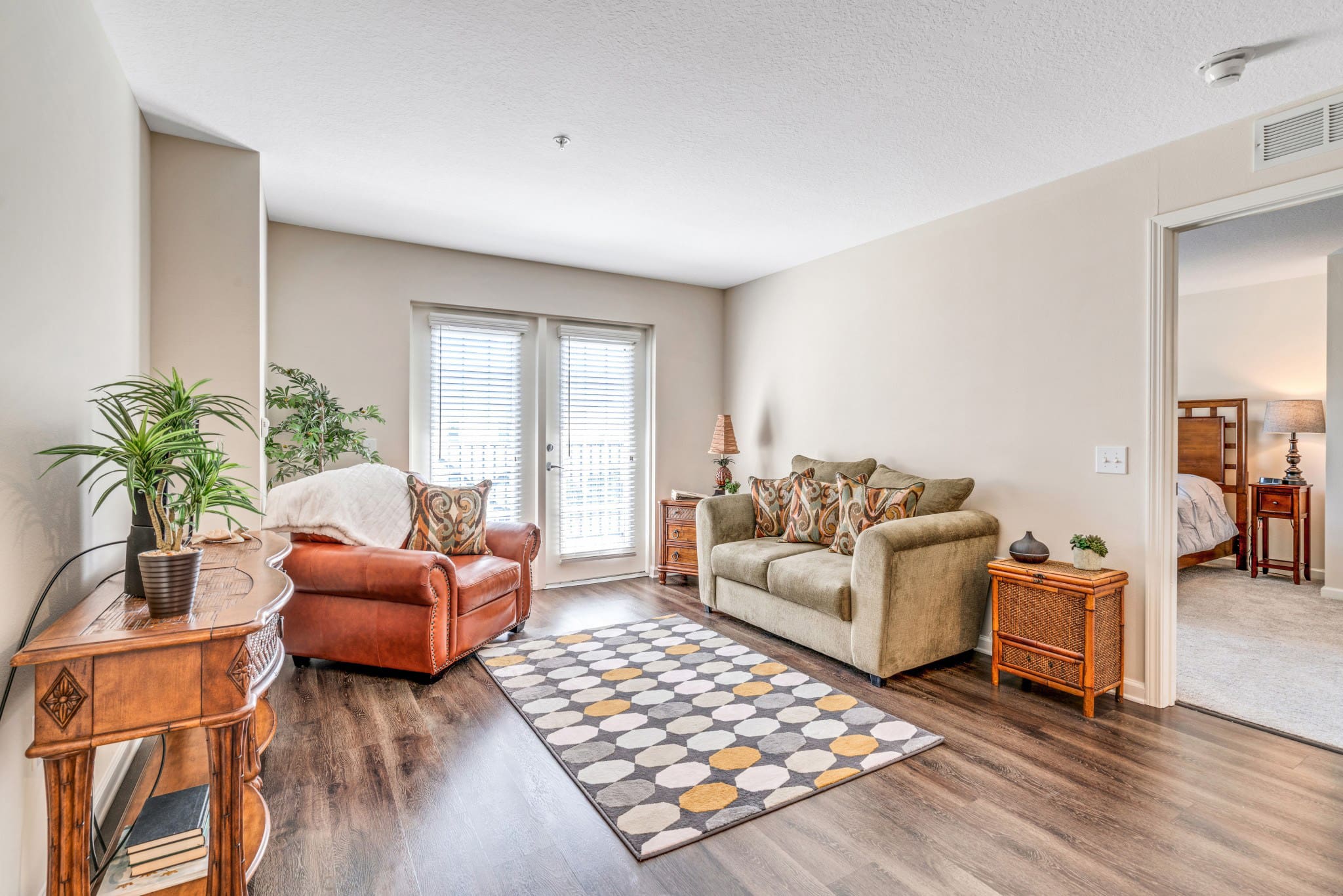 Interior image of a resident's living room at Camellia at Deerwood, senior living community in Florida.