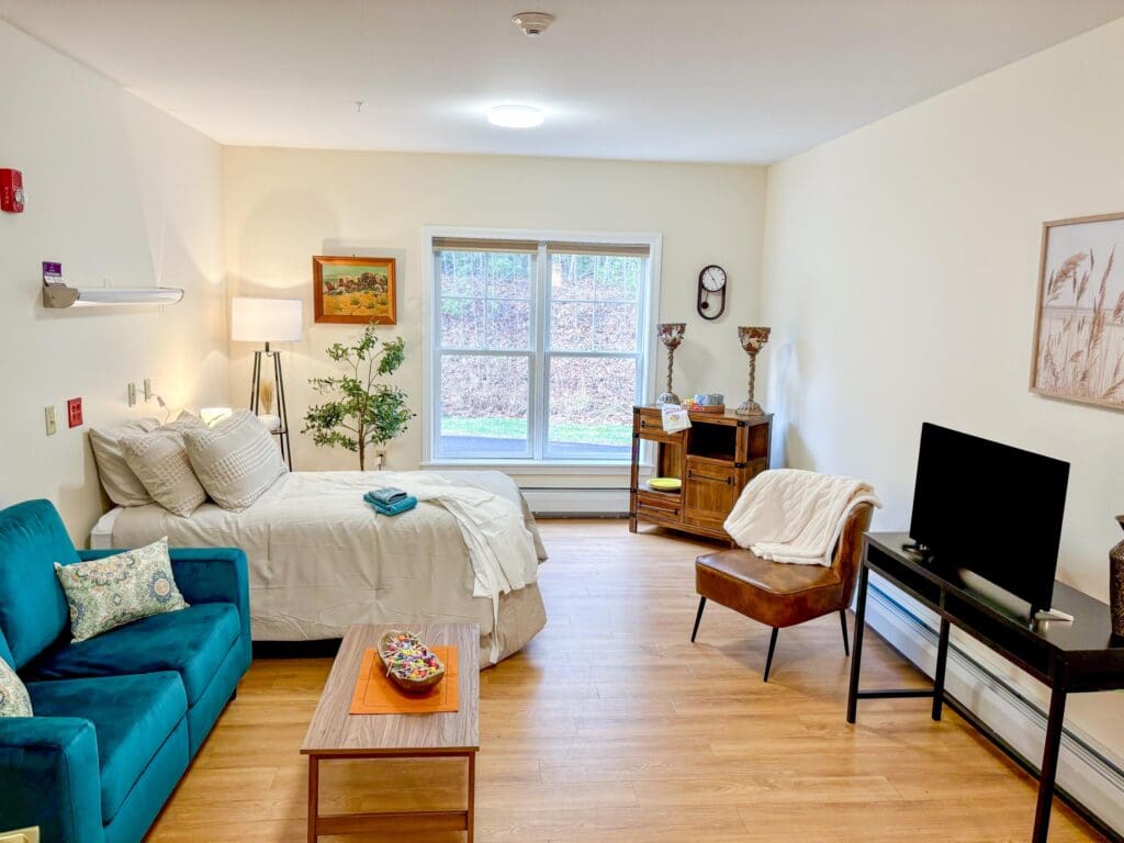 Comfortable senior living studio-bedroom at Dirigo Pines, a senior living community near Brewer, Maine.