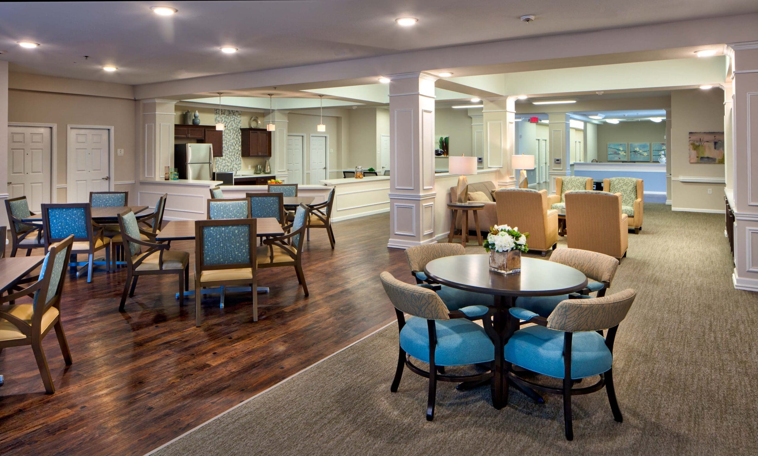 Jim-Wilson3D3A5867RT1ACAB-scaled - Grace Management Spacious communal area featuring elegant seating, dining tables, and modern kitchen, designed for a vibrant, engaging lifestyle.