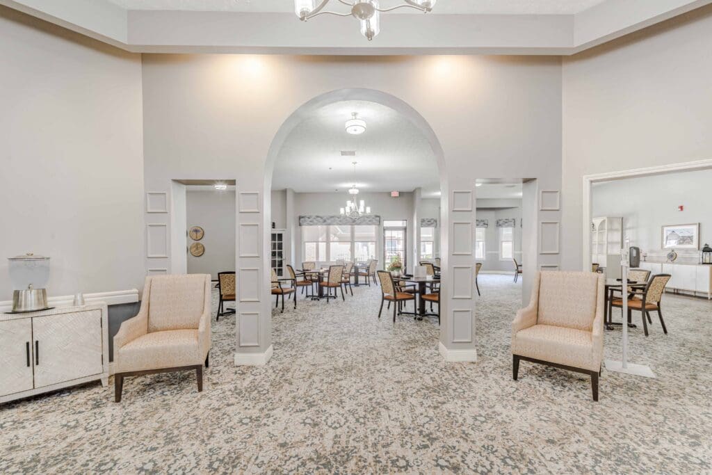 - Grace Management Interior shot of Inspirations of Mount Washington's social area with comfortable furniture in a well light, bright room.