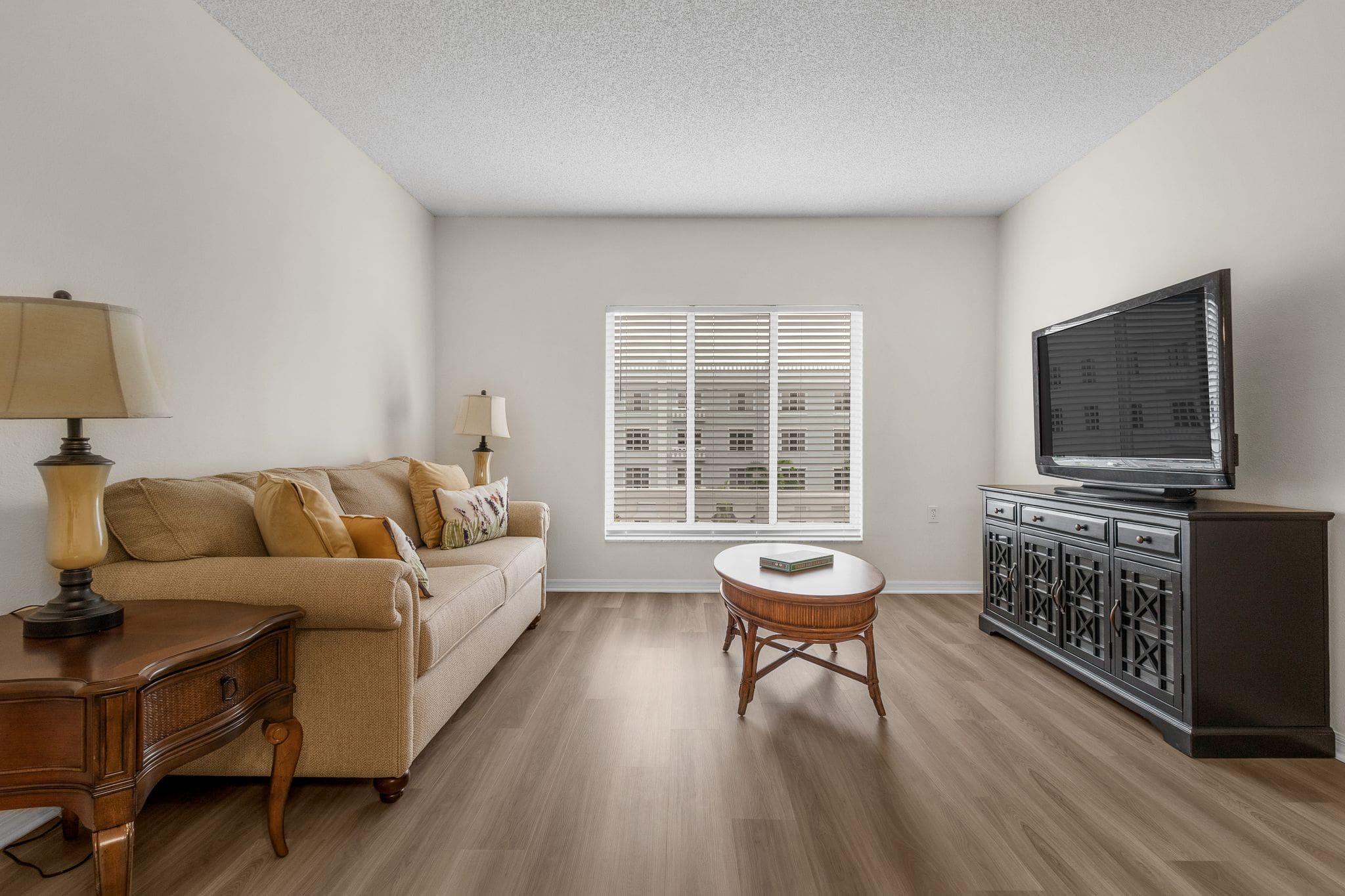 - Grace Management Apartment Living Room at The Summit of Fort Myers, an excellent option for independent living.