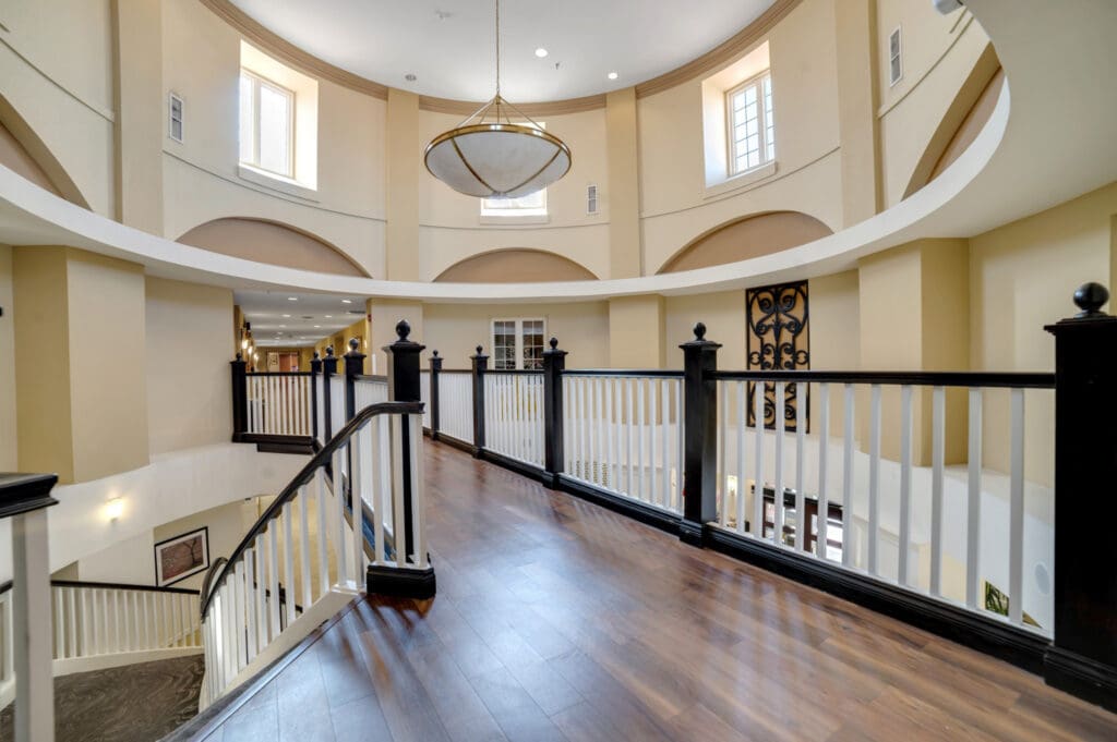 Upstairs balcony and atrium at Acacia Springs, a senior living community.