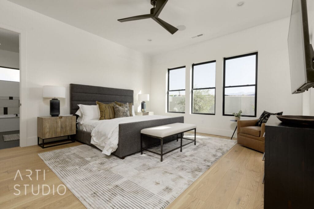 Inviting senior living bedroom featuring stylish furnishings, natural light, and cozy decor for an upscale lifestyle.