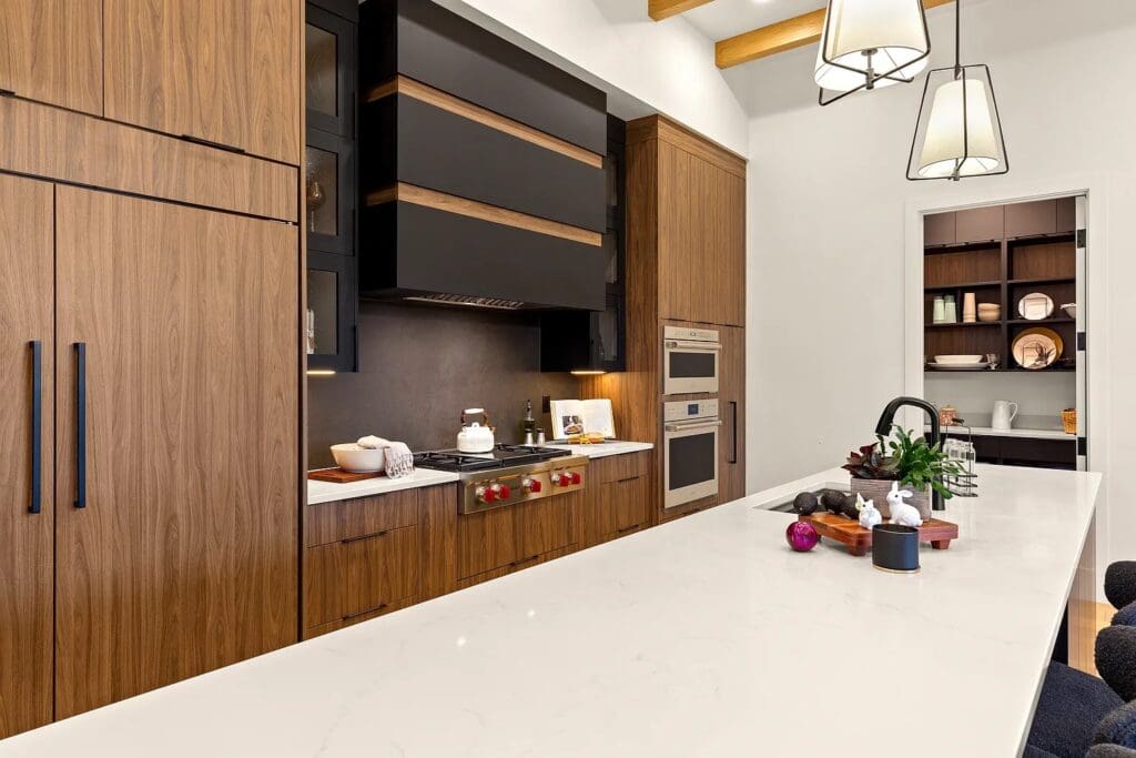 Stylish kitchen featuring modern cabinetry, a spacious island, and upscale appliances, emphasizing a vibrant, inviting atmosphere.