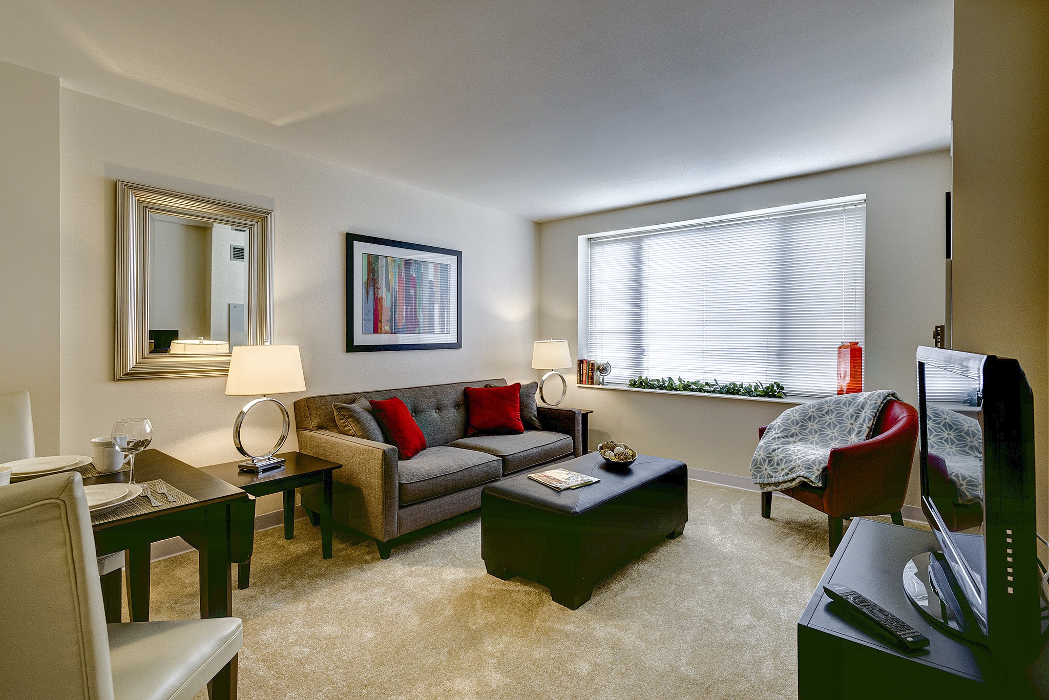 brookdale-northbrook-5-living-room - Grace Management Interior image of a senior living resident's comfortable living room with plush furniture and natural light at Inspirations of Northbrook.