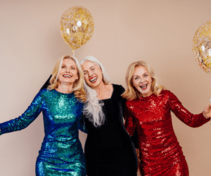 Three senior women celebrating